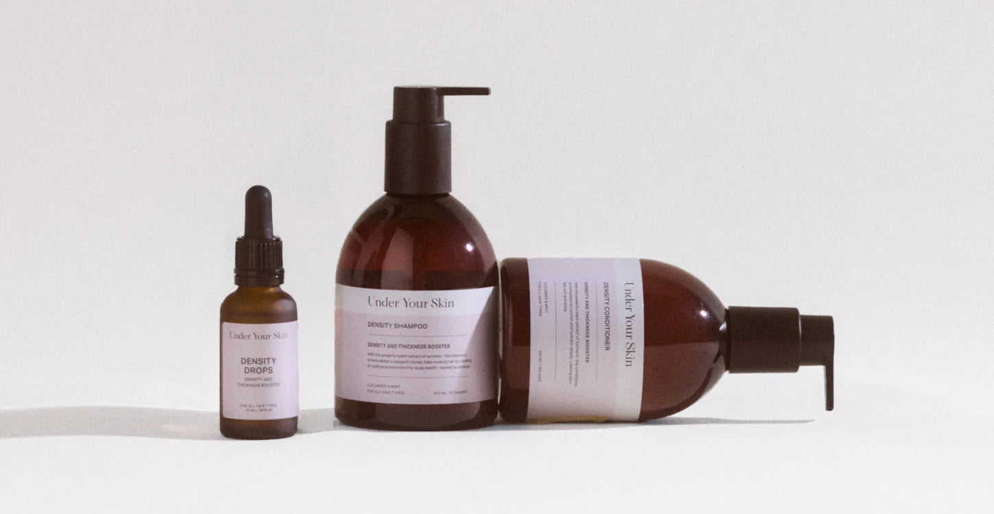 Hair growth treatment kit produkter på en vit bakgrund