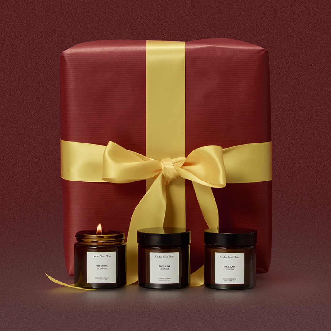 3 candles and a giftbox on the background.