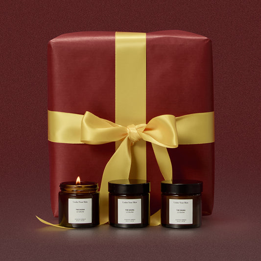 3 candles and a giftbox on the background.