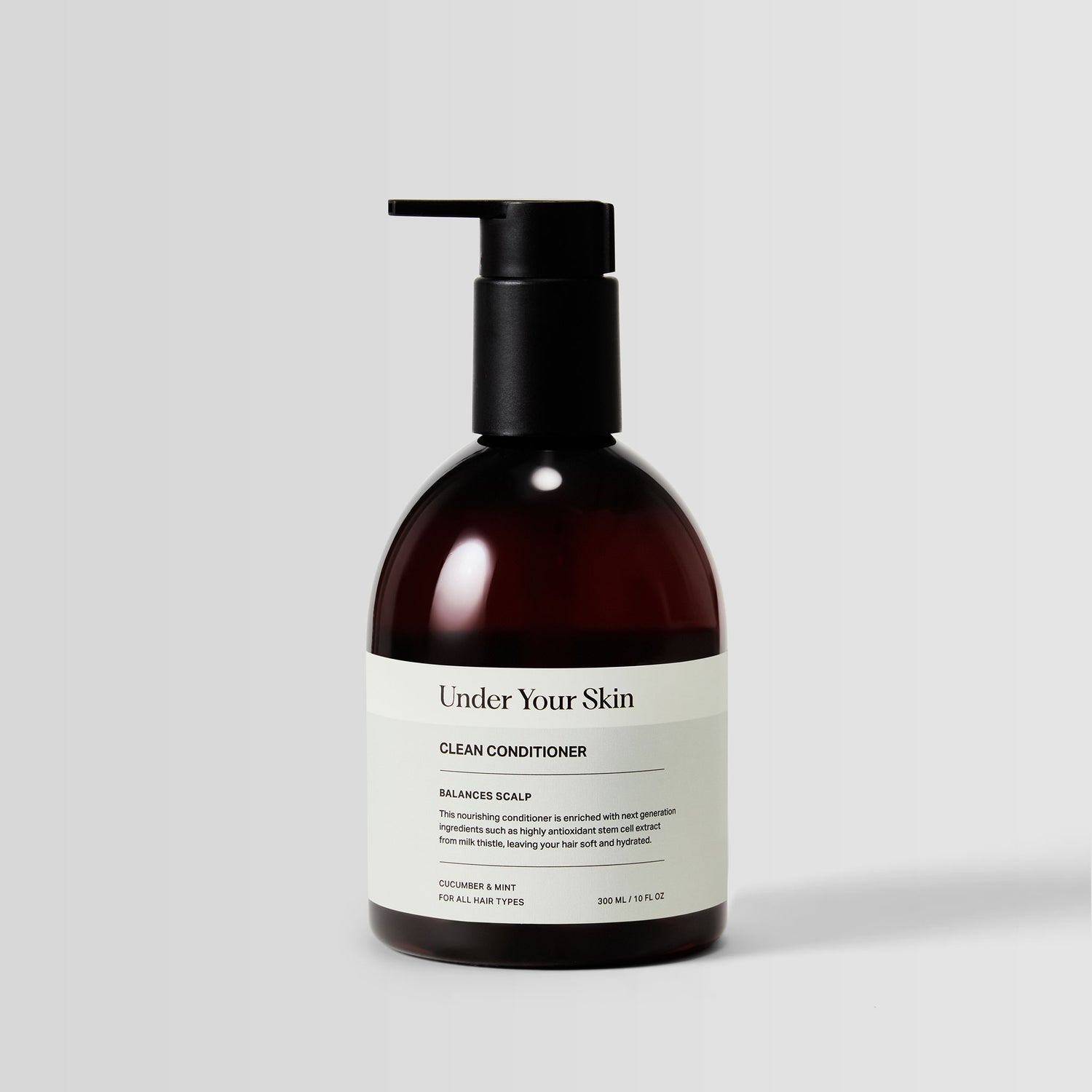 Under Your Skin Detox Clean Conditioner in a 300ml brown bottle with pump. Clarifies hair for hydration and softness without silicones. 