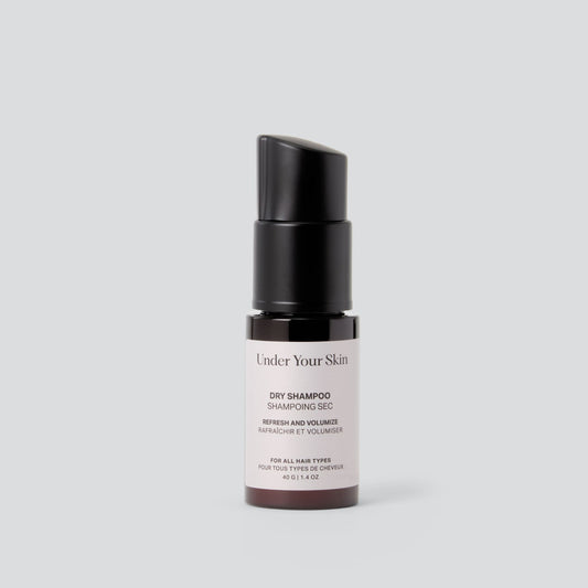 Under Your Skin Powder Dry Shampoo in a 40g/1.4 oz brown bottle with pump dispenser. Refreshes roots and absorbs oil to extend time between washes